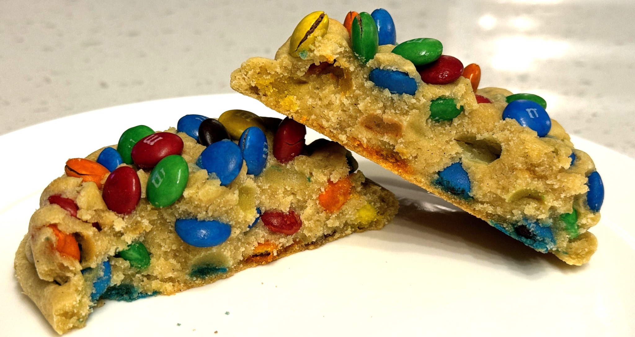 m&m deluxe cookie split open and packed with colorful milk chocolate candies